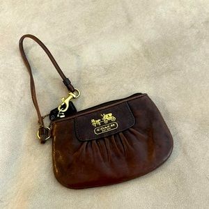 Brown leather Coach wristlet